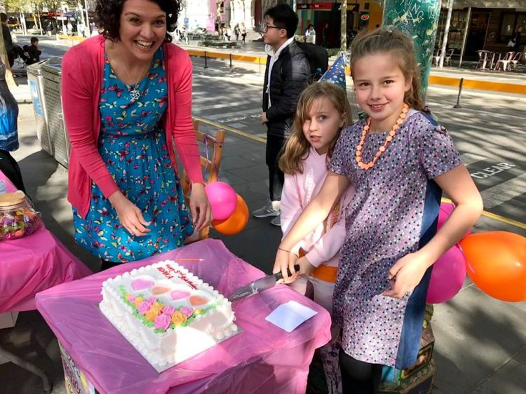 Isabelle Cameron (R) with her mother Simone and friend Mia, with Kopika's birthday cake