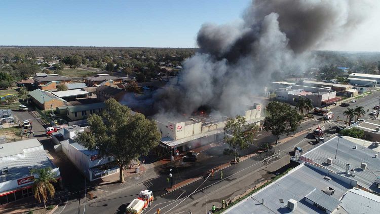 The local supermarket burns. Photograph by Vanessa Hickey