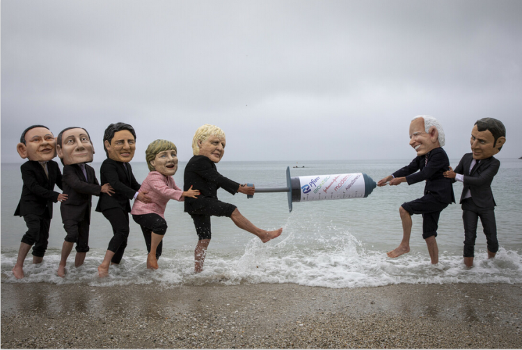 Campaigners for The People’s Vaccine Alliance pose as G7 political leaders: Joe Biden (US), Mario Draghi (Italy), Boris Johnson (UK), Emmanuel Macron (France), Angela Merkel (Germany), Justin Trudeau (Canada), Yoshihide Suga (Japan). Photo by Andrew Aitchison/In Pictures via Getty Images, supplied by Oxfam.
