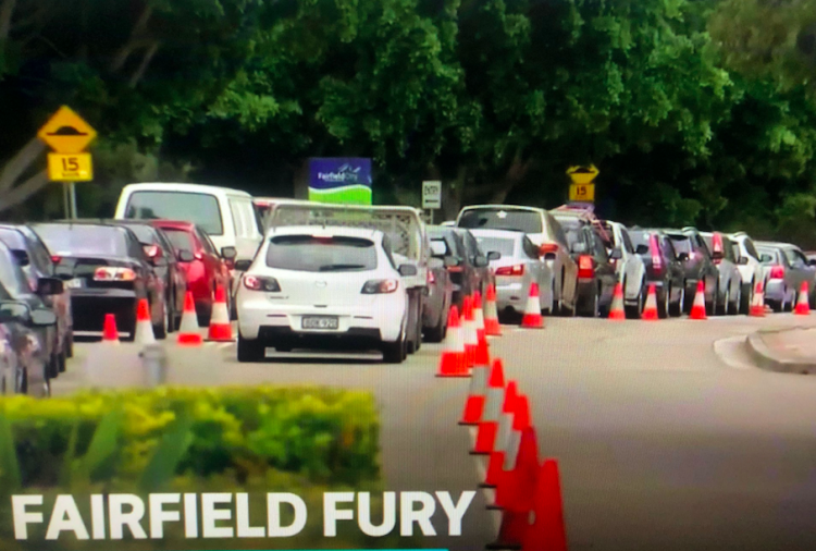 Residents of Fairfield in Sydney's south-west line up for COVID-19 testing. Screenshot from ABC TV News