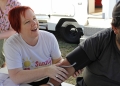 Sonia Martin with a patient at mobile outreach health service, Sunny Street. Supplied by Martin.