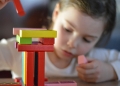 Child with building blocks